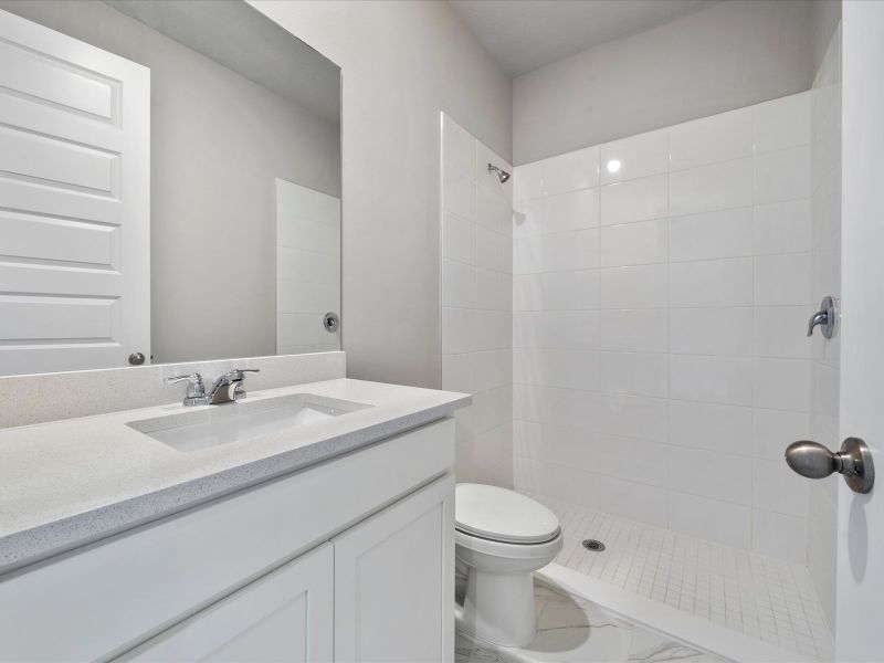 Bathroom in the Coral floorplan at 6295 NW Sweetwood Drive in Brystol at Wylder