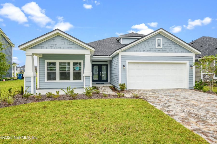 Front exterior of a new home in Amberly, Green Cove Springs, FL, highlighting curb appeal (Image 1). Front exterior of a new home in Amberly, Green Cove Springs, FL, highlighting curb appeal (Image 1).
