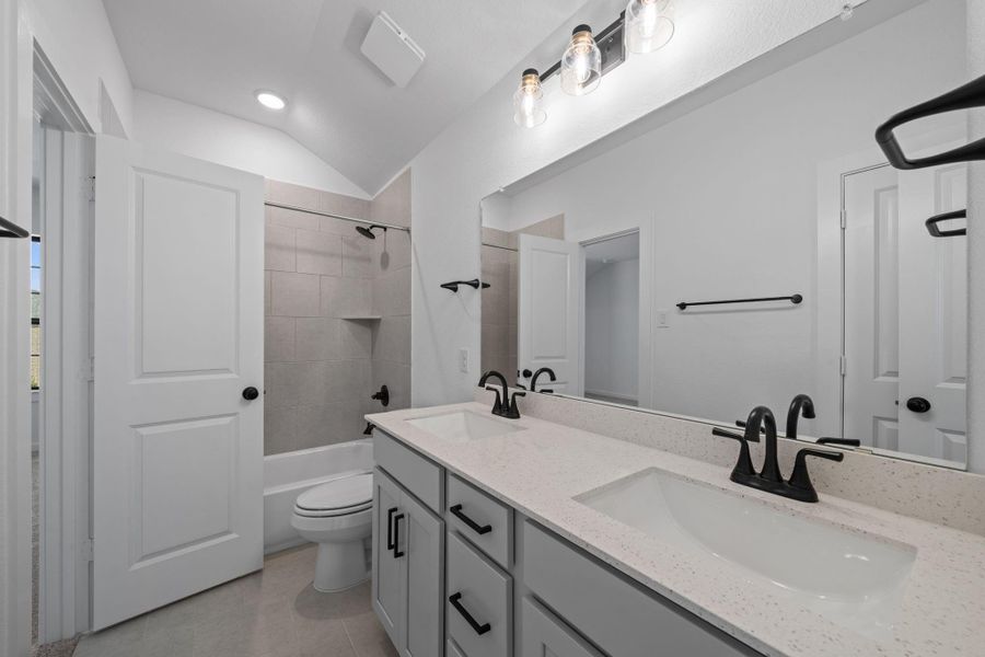This bathroom has plenty of storage and counter space. This bathroom has plenty of storage and counter space.