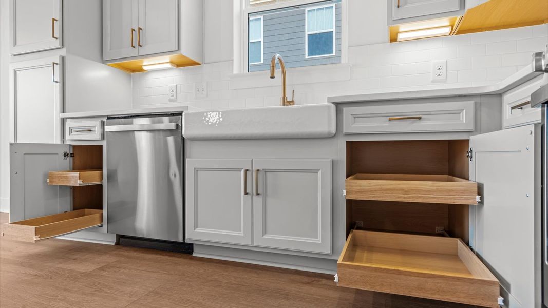 Superior craftsmanship shines in this modern kitchen with a space-saving island and open flow