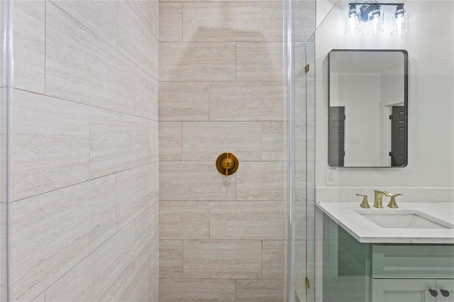 Stunning main bathroom with glass shower.