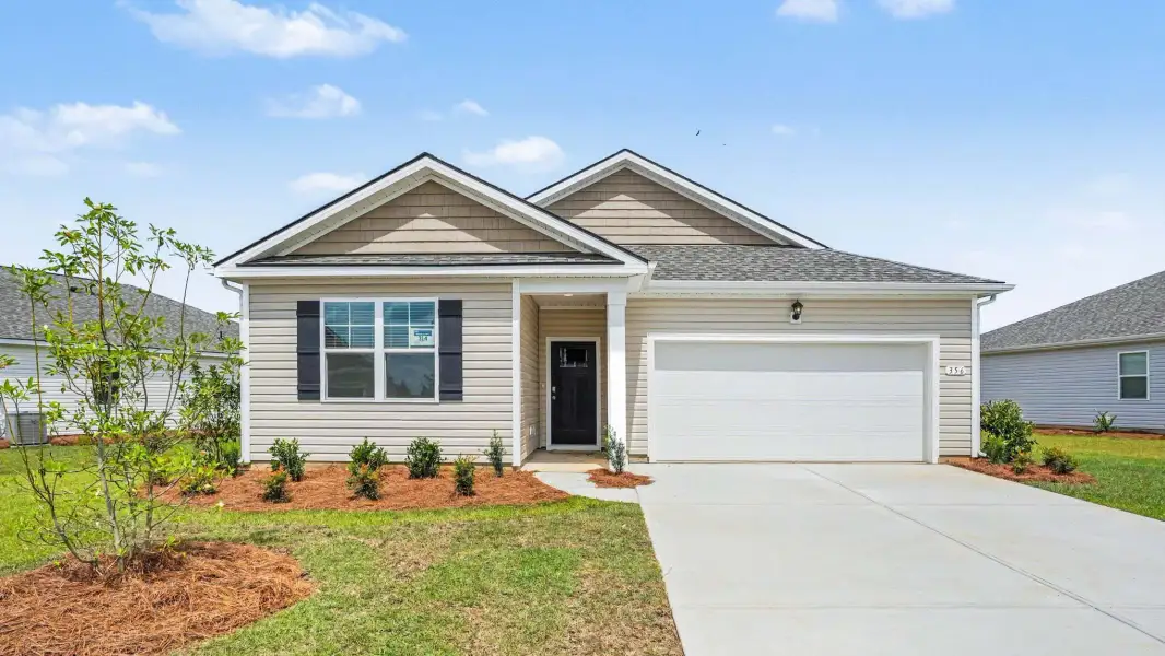 Front exterior of a new home in Evington Place, Longs, SC, highlighting curb appeal (Image 2).