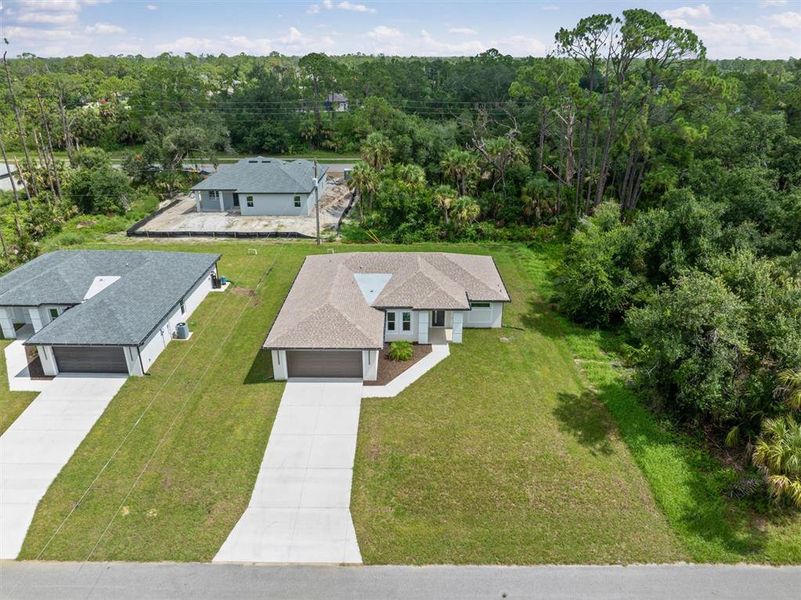 Front exterior of a new home in , Port Charlotte, FL, highlighting curb appeal (Image 28). Front exterior of a new home in , Port Charlotte, FL, highlighting curb appeal (Image 28).
