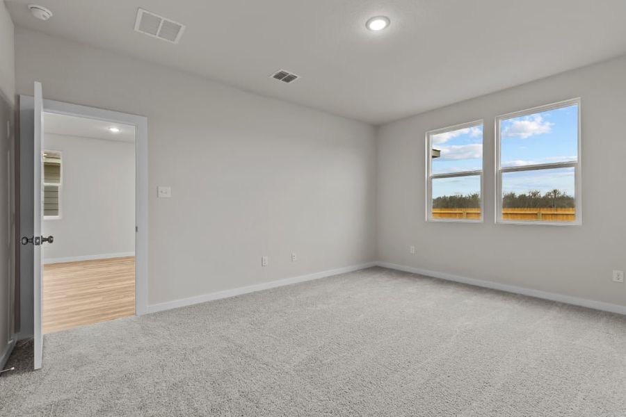 A room with a window and a door.