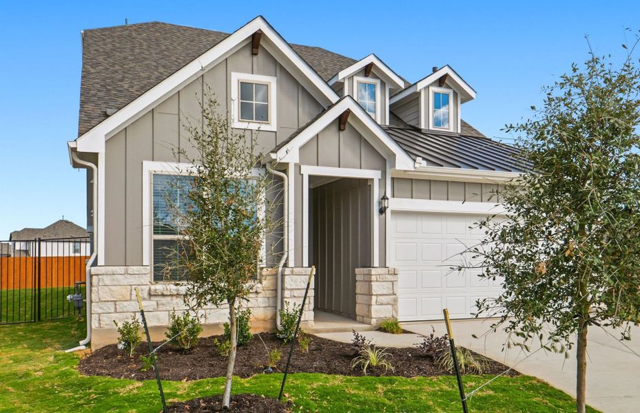Front exterior of a new home in Santa Rita Ranch, Liberty Hill, TX, highlighting curb appeal (Image 23).