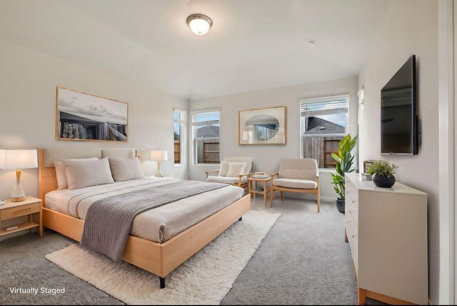 This photo of the master bedroom is virtually staged.