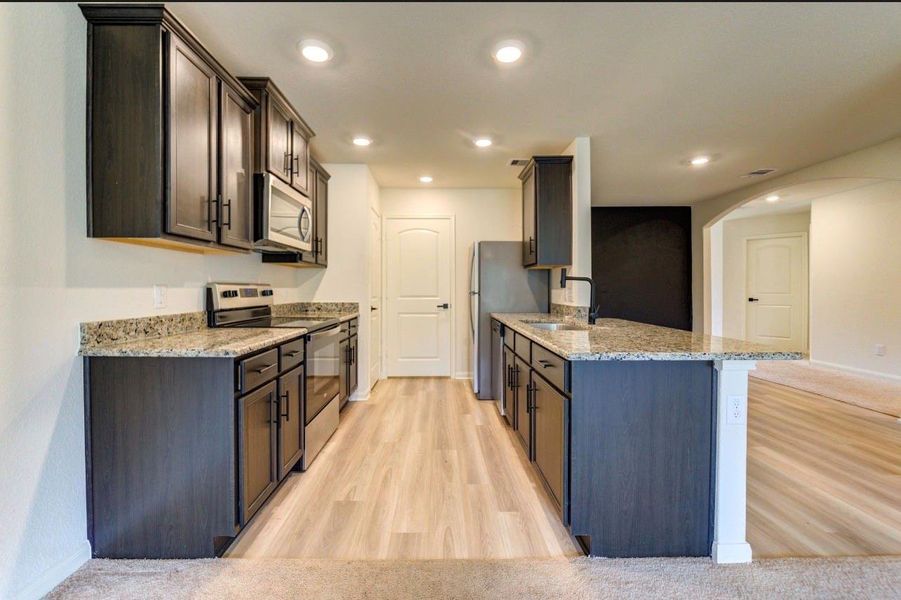 Furnished interior view inside a new home in Williams Trace, Magnolia (Image 8).