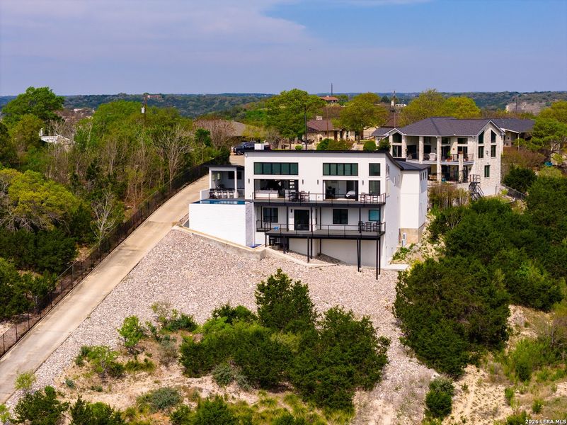 Front exterior of a new home in , Kerrville, TX, highlighting curb appeal (Image 21).