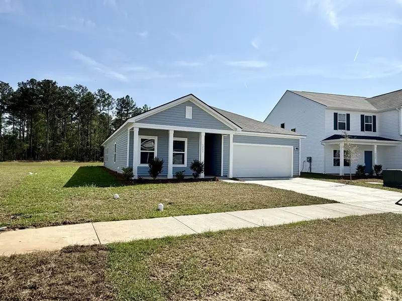Front exterior of a new home in , Summerville, SC, highlighting curb appeal (Image 19).