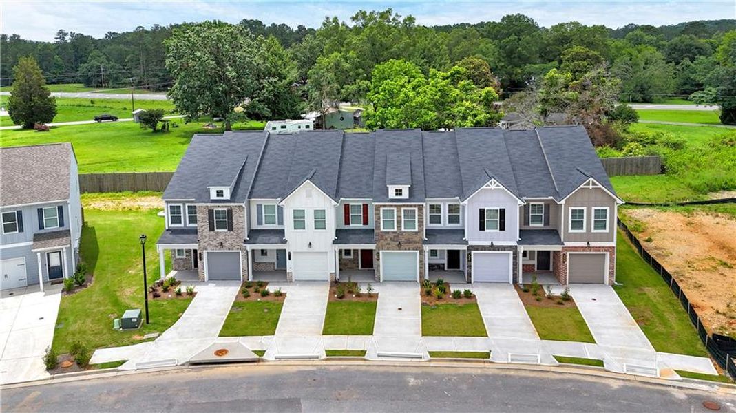 Front exterior of a new home in Village Green, Adairsville, GA, highlighting curb appeal (Image 22).