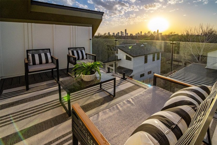 Balcony at dusk with a city view