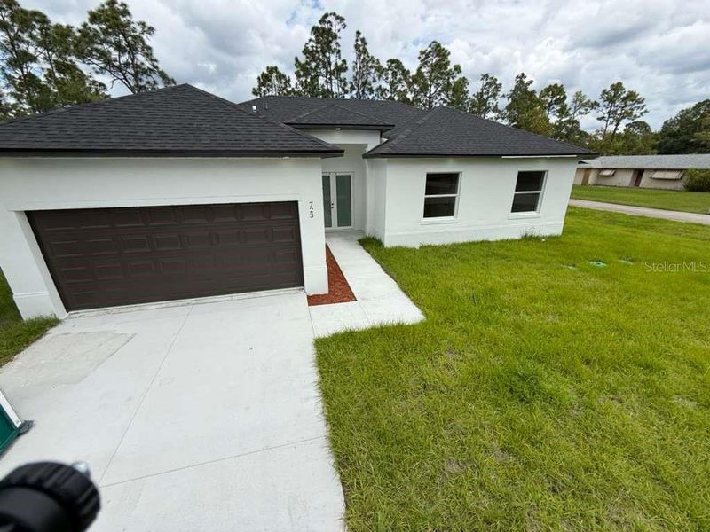 Exterior details and patio area of a home in , Lehigh Acres (Image 25). Exterior details and patio area of a home in , Lehigh Acres (Image 25).