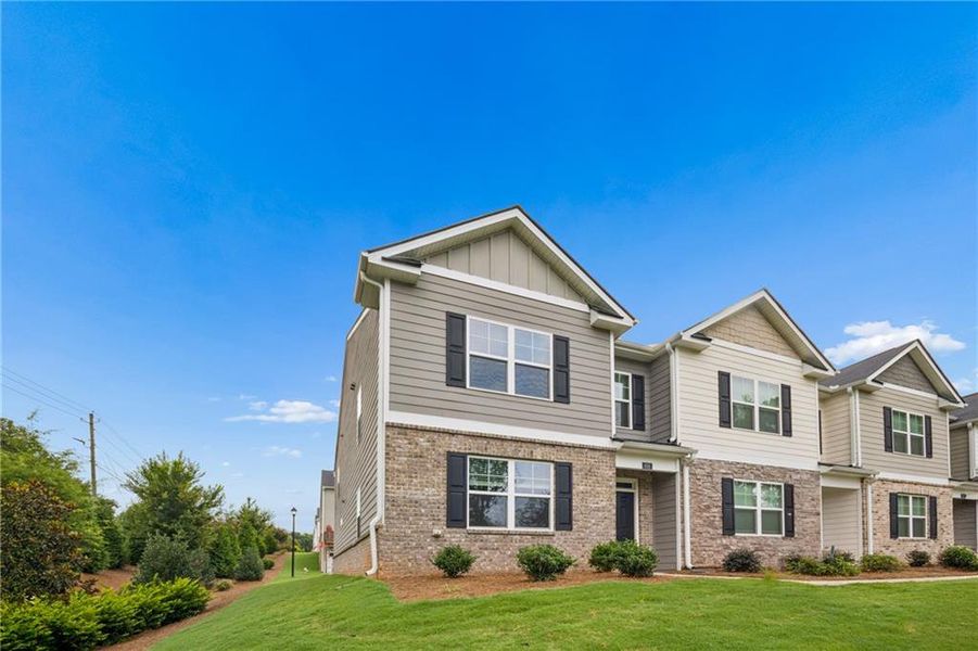 Front exterior of a new home in , Lawrenceville, GA, highlighting curb appeal (Image 1). Front exterior of a new home in , Lawrenceville, GA, highlighting curb appeal (Image 1).