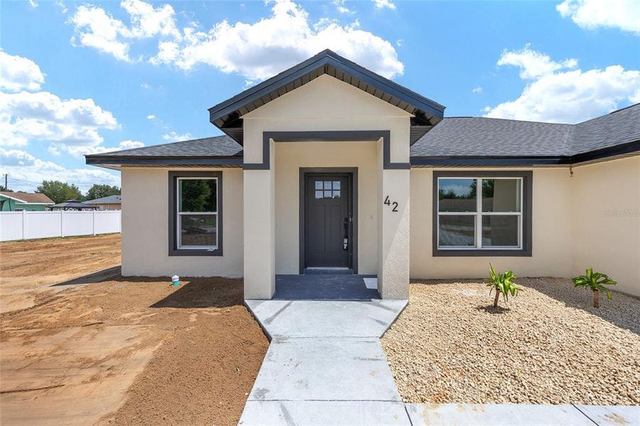 Front exterior of a new home in , Ocala, FL, highlighting curb appeal (Image 29). Front exterior of a new home in , Ocala, FL, highlighting curb appeal (Image 29).