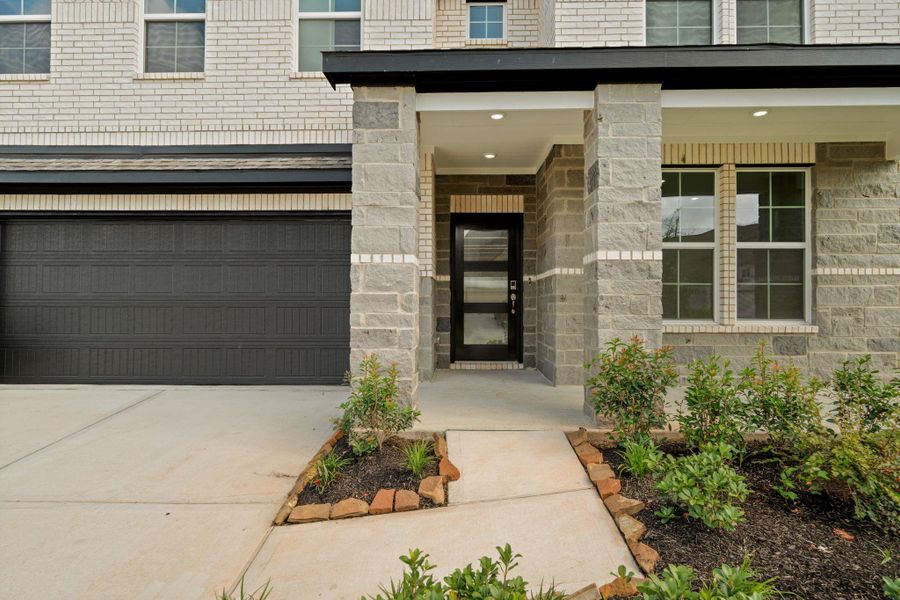 Exterior details and patio area of a home in Sunterra, Katy (Image 3). Exterior details and patio area of a home in Sunterra, Katy (Image 3).