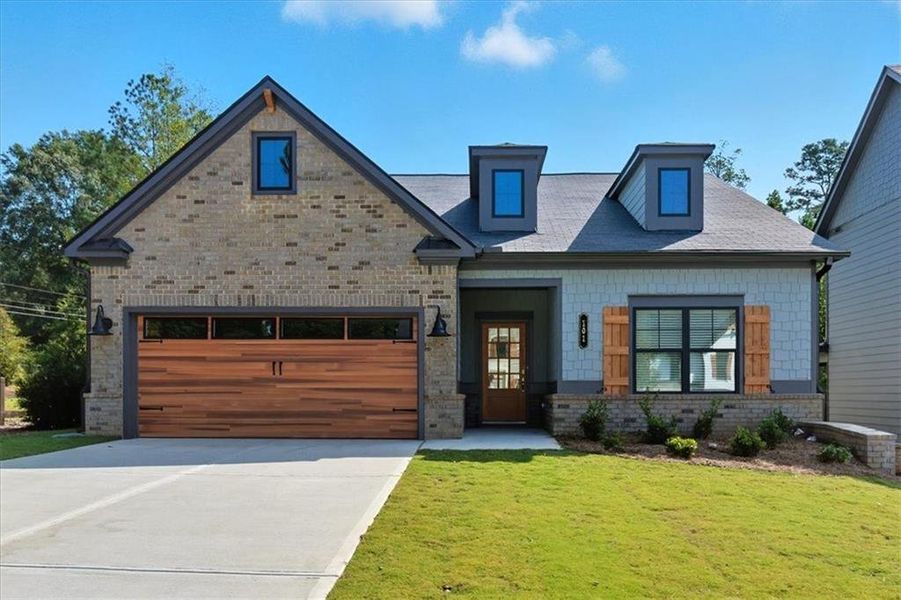 Front exterior of a new home in Meadow Pines, Dallas, GA, highlighting curb appeal (Image 1). Front exterior of a new home in Meadow Pines, Dallas, GA, highlighting curb appeal (Image 1).