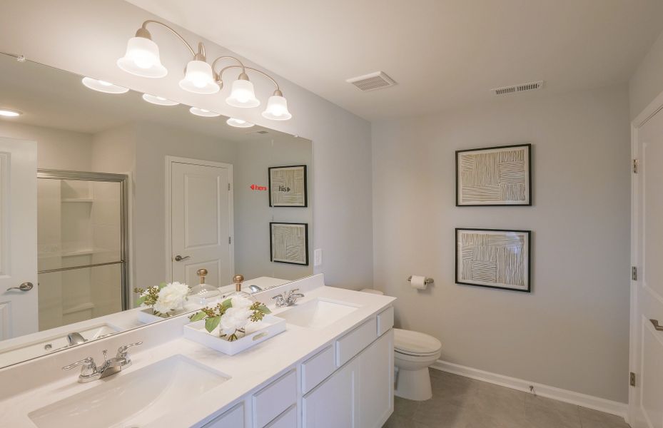 Owner's Bathroom with Dual Sink Vanity, Walk-in Shower and Linen Closet