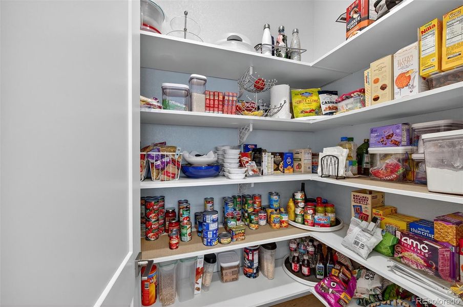 Pantry – Spacious walk-in pantry offering ample shelving for organized storage of dry goods, cookware, and small appliances.