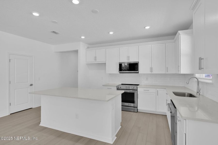 Furnished interior view inside a new home in Bradley Creek, Green Cove Springs (Image 10).