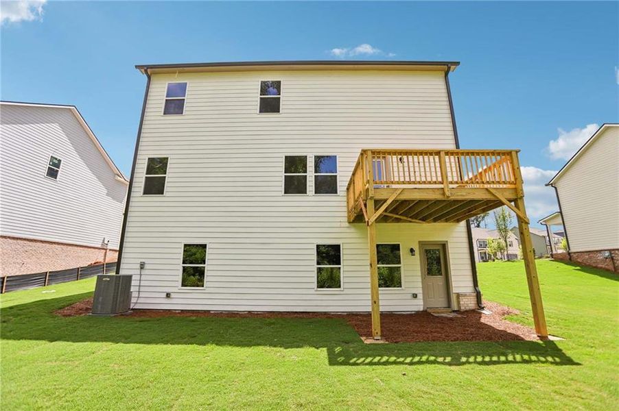 Exterior details and patio area of a home in The Pointe at Heron Bay, Locust Grove (Image 3).
