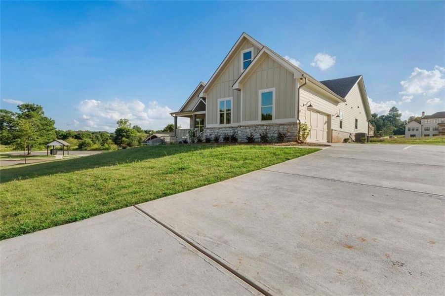 Front exterior of a new home in SteepleChase, Hoschton, GA, highlighting curb appeal (Image 2).