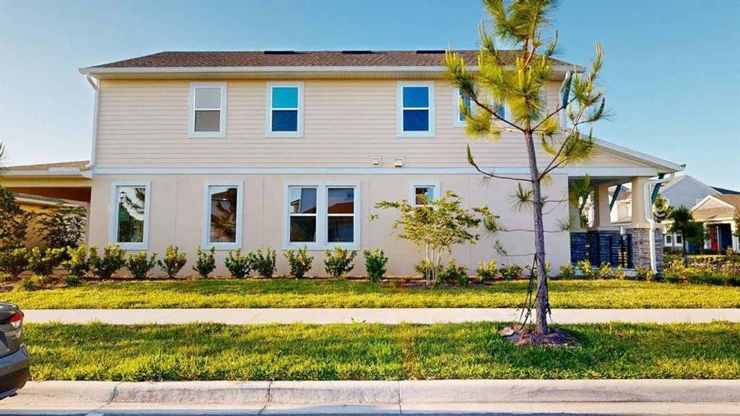 Front exterior of a new home in , Orlando, FL, highlighting curb appeal (Image 24).