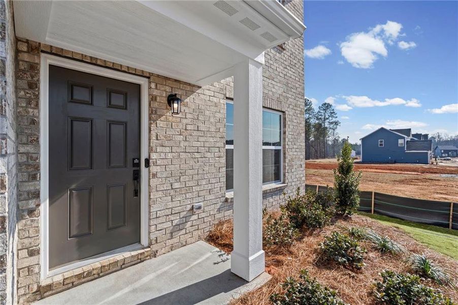 Exterior details and patio area of a home in Twin Lakes, Hoschton (Image 4).