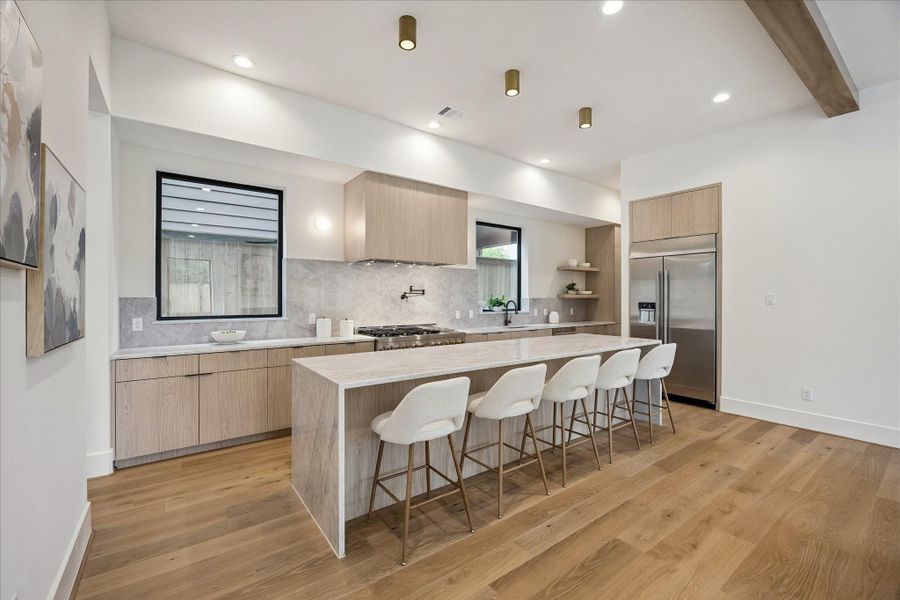 Kitchen - wide plank wood flooring and designer lighting. Kitchen - wide plank wood flooring and designer lighting.