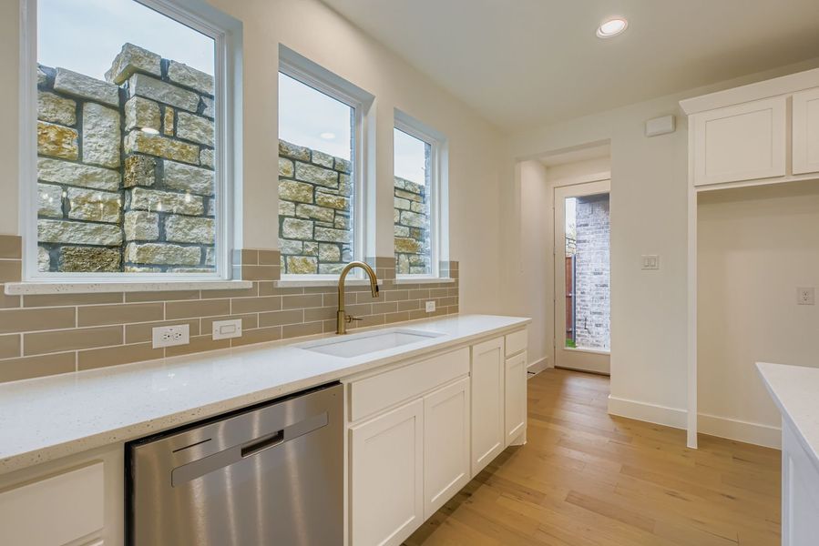 Furnished interior view inside a new home in Castle Hills Northpointe - Townhomes, Lewisville (Image 10).