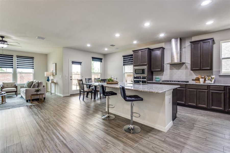 Large kitchen with gas cooktop, tons of cabinets and island. Large kitchen with gas cooktop, tons of cabinets and island.