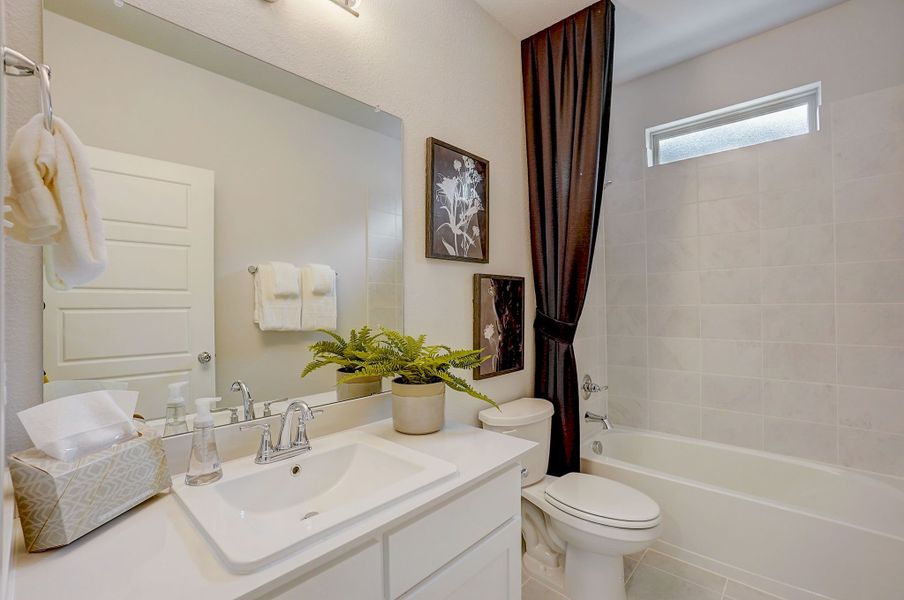Bathroom in the Stanley II home plan by Trophy Signature Homes - REPRESENTATIVE PHOTO