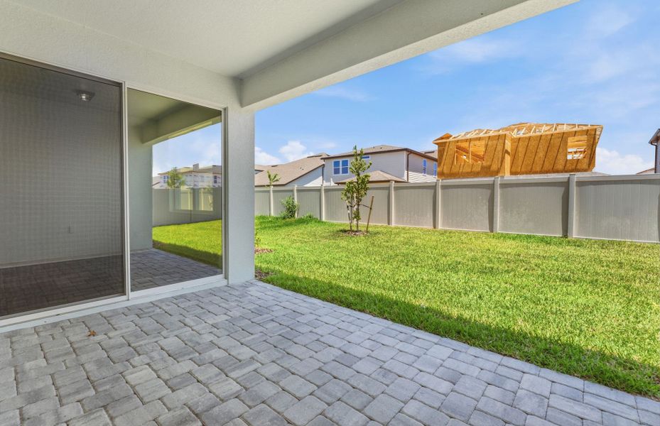 Exterior details and patio area of a home in Vida's Way, Wesley Chapel (Image 4).