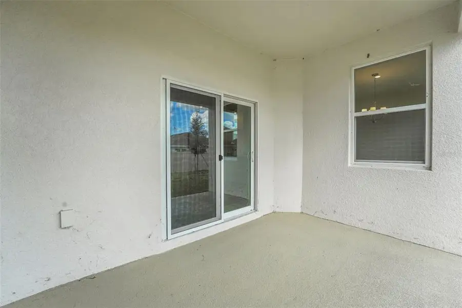 Exterior details and patio area of a home in Cypress Park Estates, Haines City (Image 3).