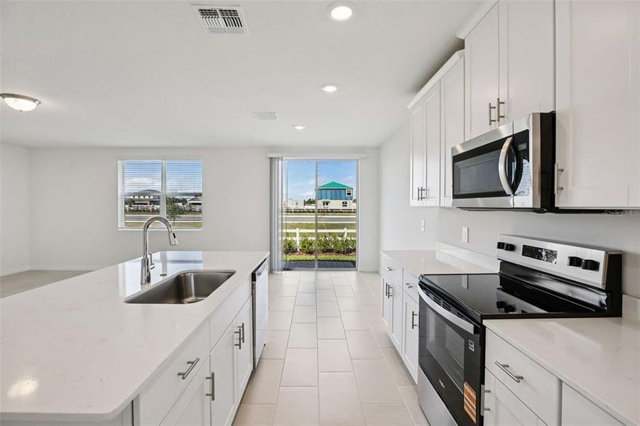 Furnished interior view inside a new home in Villamar - Signature Series, Winter Haven (Image 13).