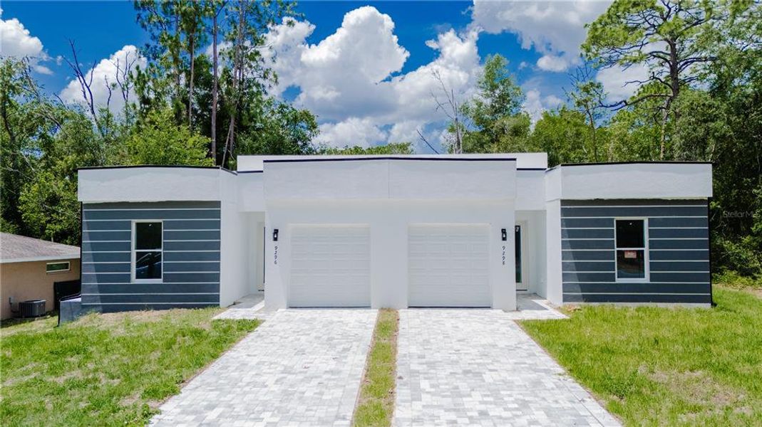 Front exterior of a new home in , Citrus Springs, FL, highlighting curb appeal (Image 2). Front exterior of a new home in , Citrus Springs, FL, highlighting curb appeal (Image 2).