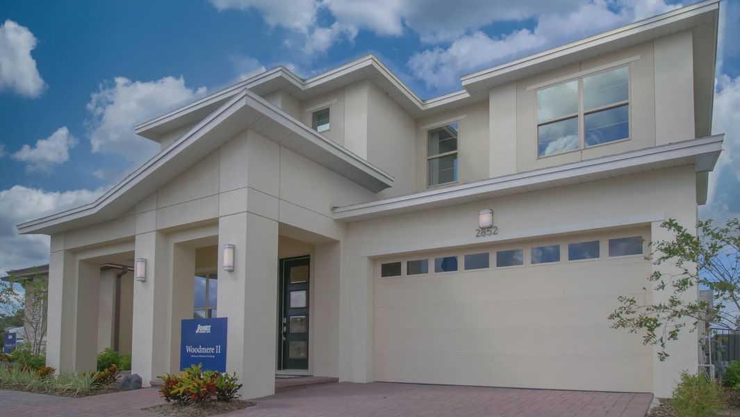 Representative exterior photo of a completed home built from the Woodmere II by Jones Homes USA in Reserve at Twin Lakes, St. Cloud, FL (Image 9). Representative exterior photo of a completed home built from the Woodmere II by Jones Homes USA in Reserve at Twin Lakes, St. Cloud, FL (Image 9).