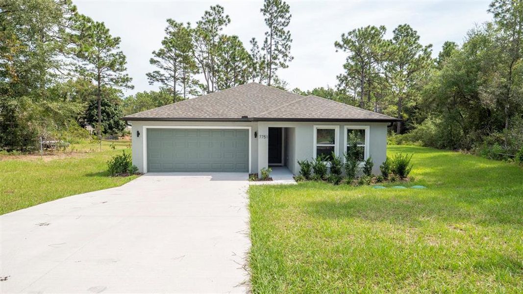 Front exterior of a new home in , Citrus Springs, FL, highlighting curb appeal (Image 18). Front exterior of a new home in , Citrus Springs, FL, highlighting curb appeal (Image 18).
