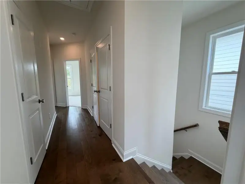 Laundry situated in Hallway to separating Owners from Guest Bedrooms *Images shown are from a different homesite featuring the Aspen Floor Plan. Design selections and colors will vary by home. *
