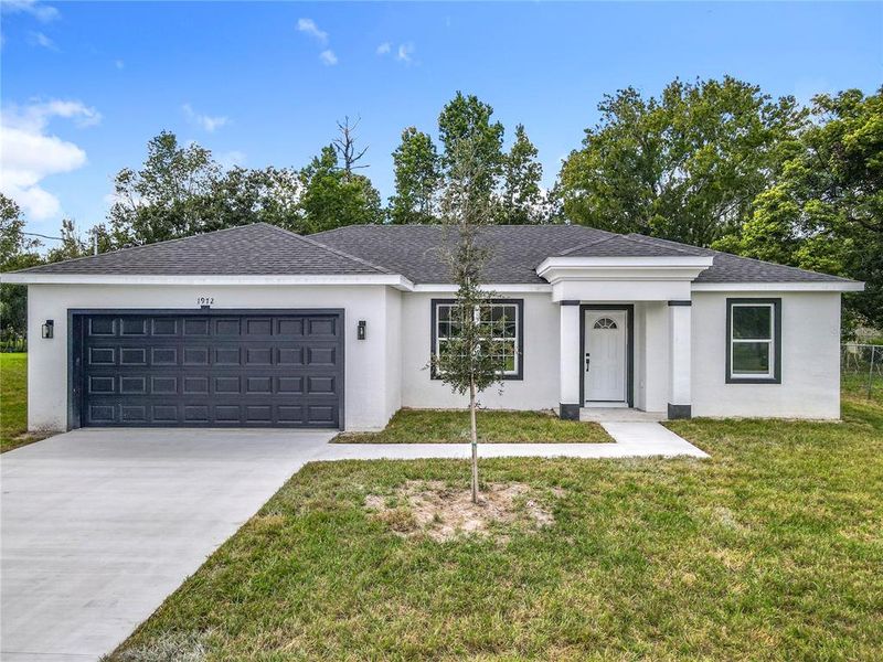 Front exterior of a new home in , Deland, FL, highlighting curb appeal (Image 2).