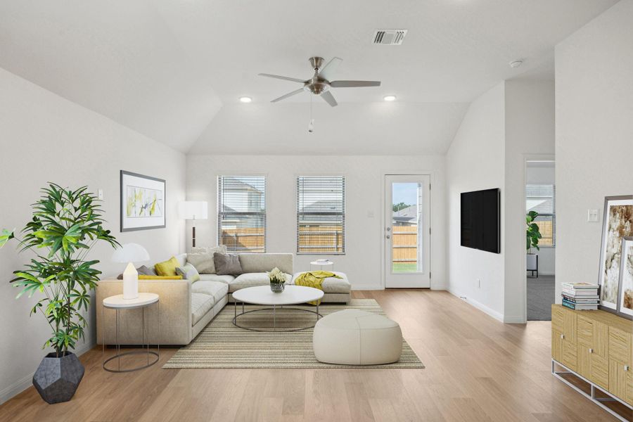 Living area with vaulted ceiling, ceiling fan, recessed lighting, and wood finished floors