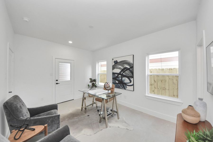 This bright, modern office space offers a clean and inviting atmosphere. White walls and two large windows fill the room with natural light, while a glass-top desk, contemporary furnishings, and a striking abstract painting create a stylish and functional workspace. This bright, modern office space offers a clean and inviting atmosphere. White walls and two large windows fill the room with natural light, while a glass-top desk, contemporary furnishings, and a striking abstract painting create a stylish and functional workspace.