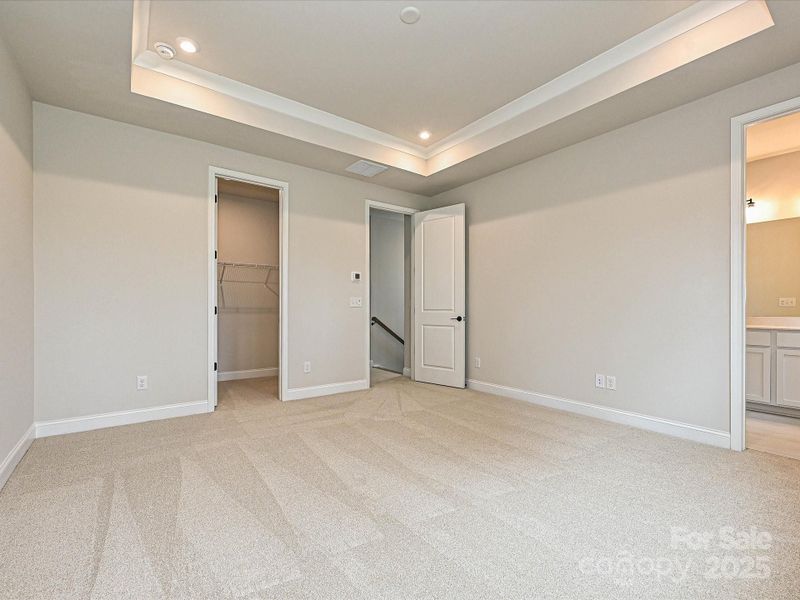 Primary Suite with En Suite Bath and Large Walk-In Closet.