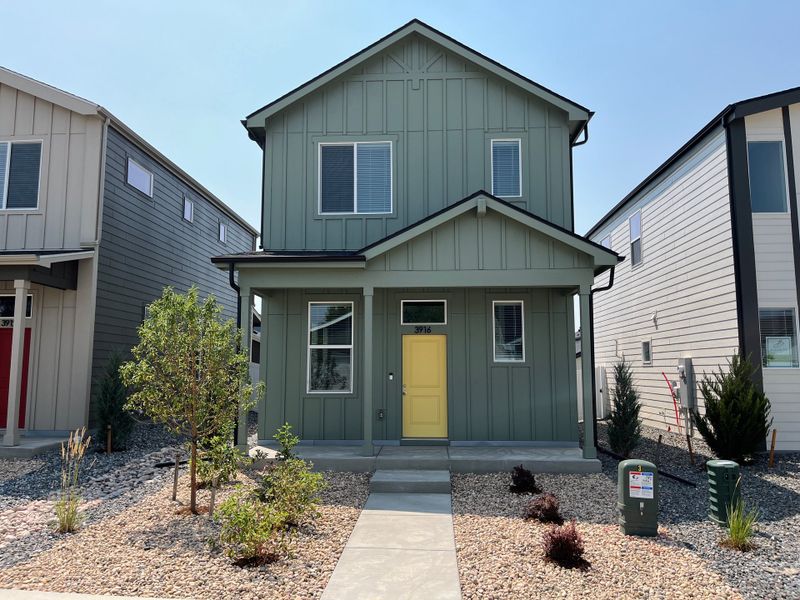 Front exterior of a new home in Liberty Draw, Evans, CO, highlighting curb appeal (Image 2). Front exterior of a new home in Liberty Draw, Evans, CO, highlighting curb appeal (Image 2).