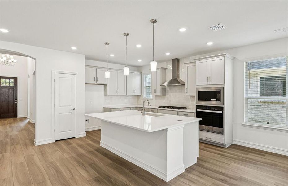 Spacious kitchen with eat-in bartop island Spacious kitchen with eat-in bartop island