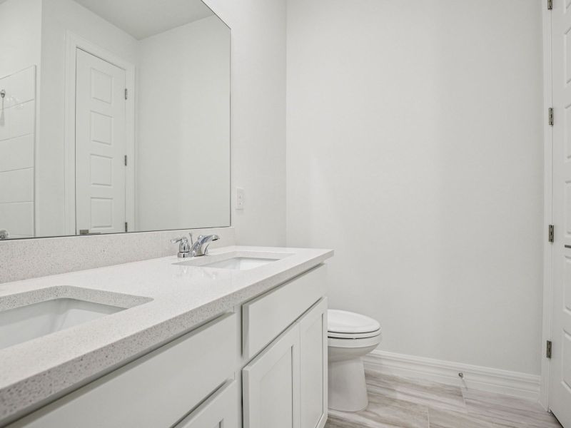 Furnished interior view inside a new home in Crescent Lakes - Reserve Series, Punta Gorda (Image 8).