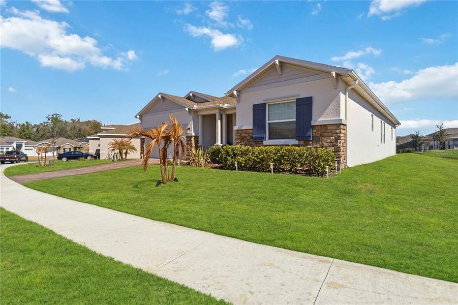 Front exterior of a new home in Providence, Davenport, FL, highlighting curb appeal (Image 2).