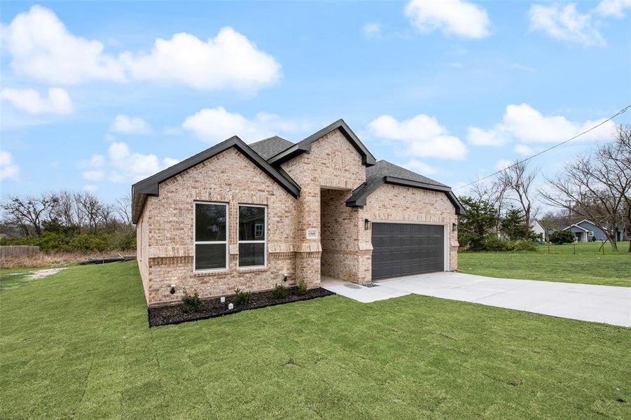 Front exterior of a new home in , Greenville, TX, highlighting curb appeal (Image 1). Front exterior of a new home in , Greenville, TX, highlighting curb appeal (Image 1).