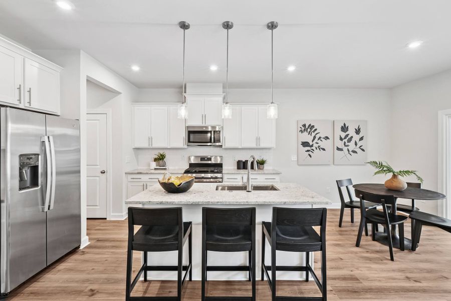 Representative furnished interior of a home built from the Eno by Tri Pointe Homes in Tredenham, Durham (Image 7).