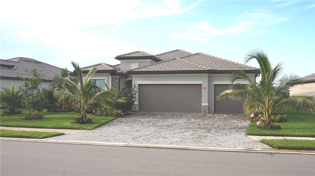 Front exterior of a new home in , Bradenton, FL, highlighting curb appeal (Image 2).