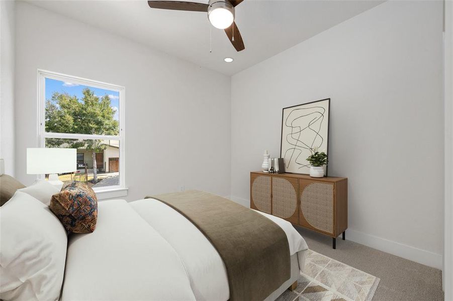 Third room is staged as a cozy guest bedroom but could also be an energizing workout room.